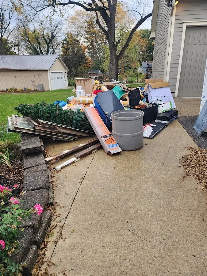 Dumpster being loaded with debris for Commercial Dumpster Rental in Centerville